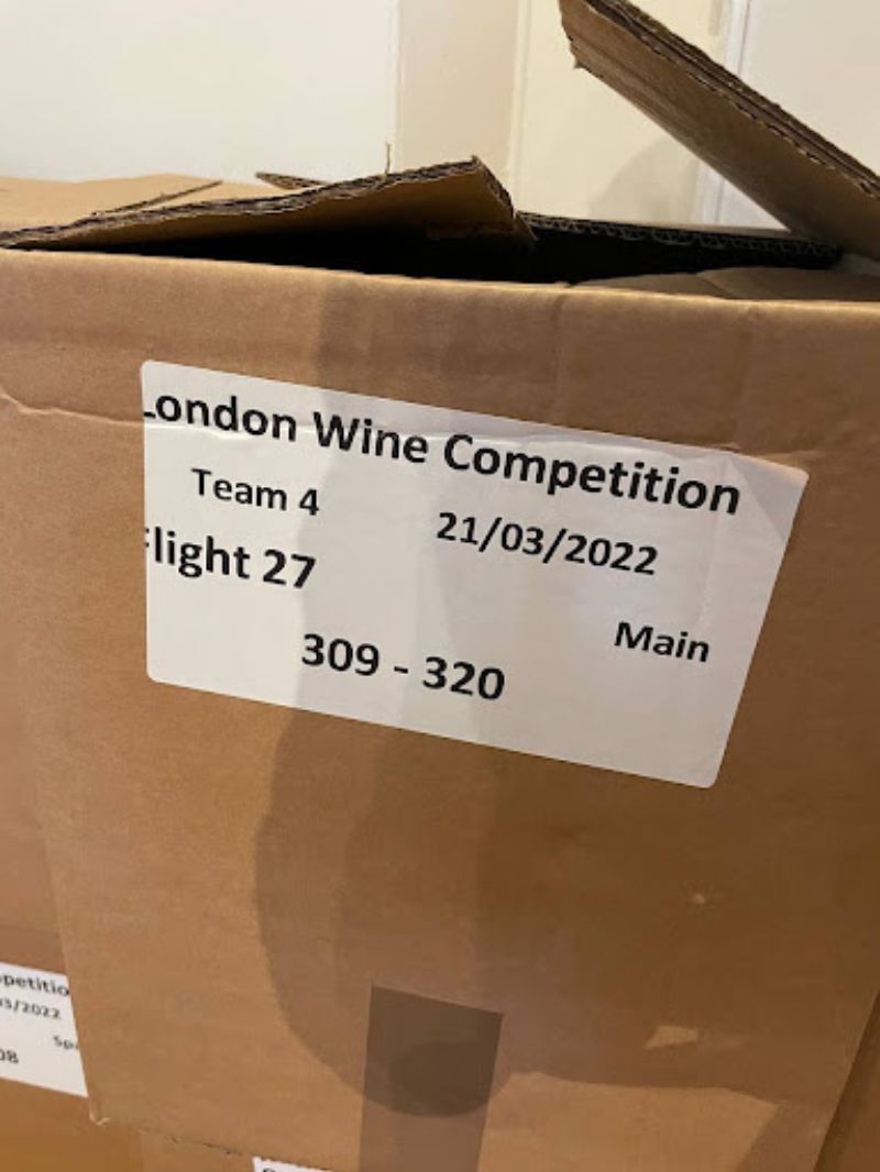 Each box is marked with a flight number and a tasting order number